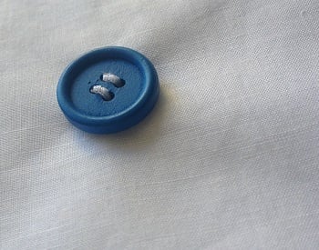 How To Sew A Button - Clothes Doctor