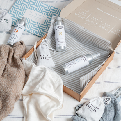 Clothes Doctor product set with bottles, cloths, and packaging on a white surface